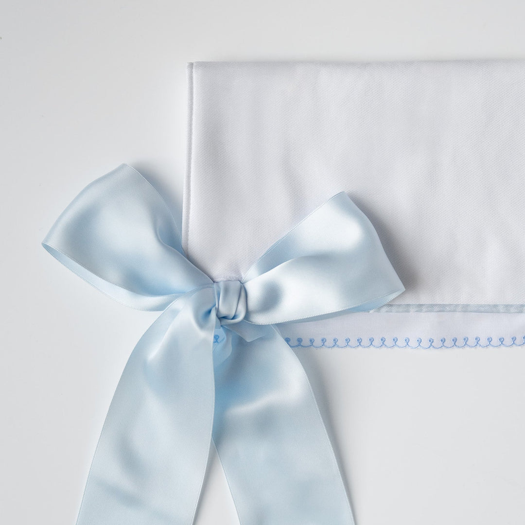 White Pique Crib Rail Topper with Blue Ribbon