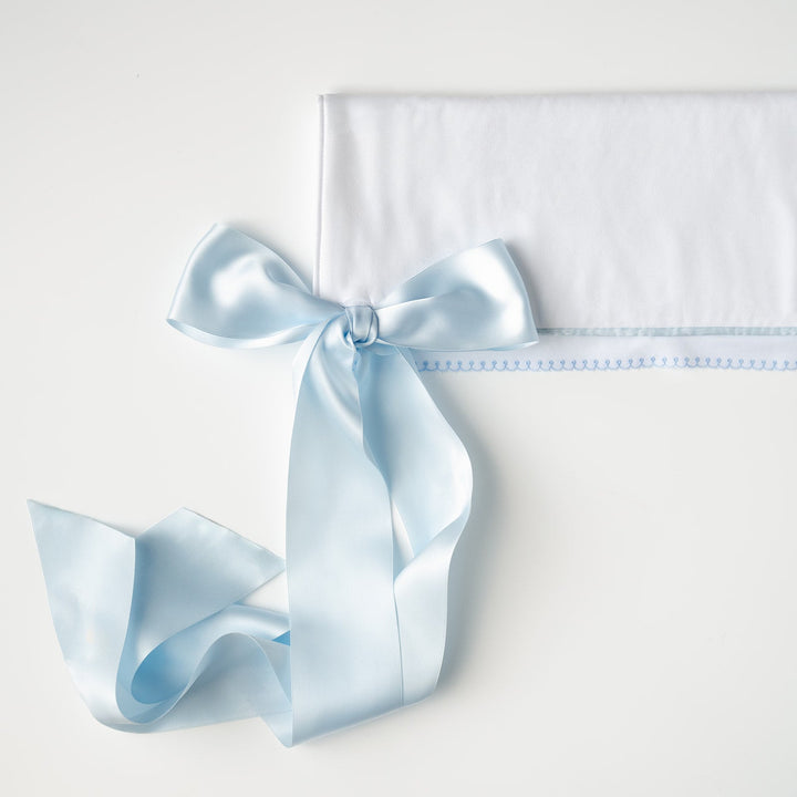 White Pique Crib Rail Topper with Blue Ribbon