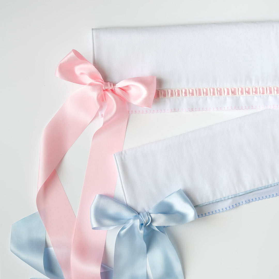 White Pique Crib Rail Topper with Blue Ribbon