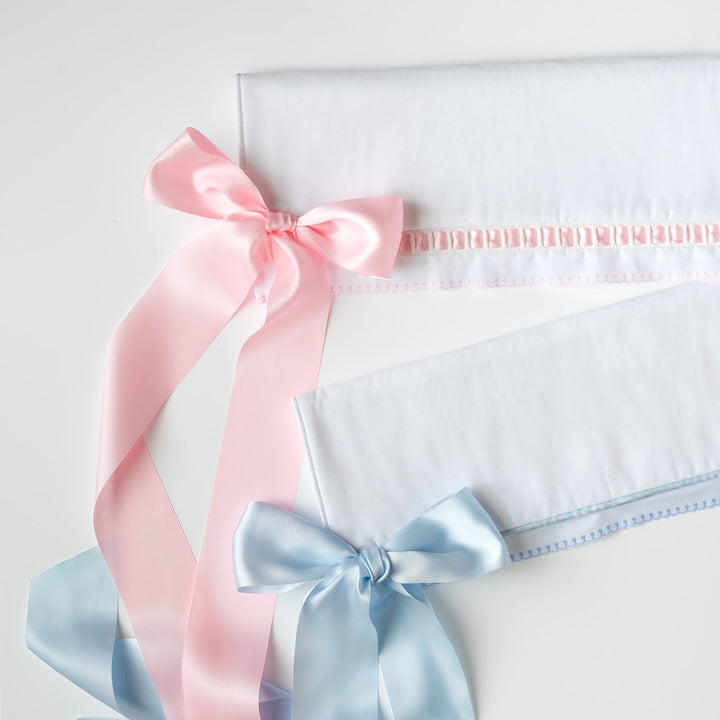 White Pique Crib Rail Topper with Blue Ribbon