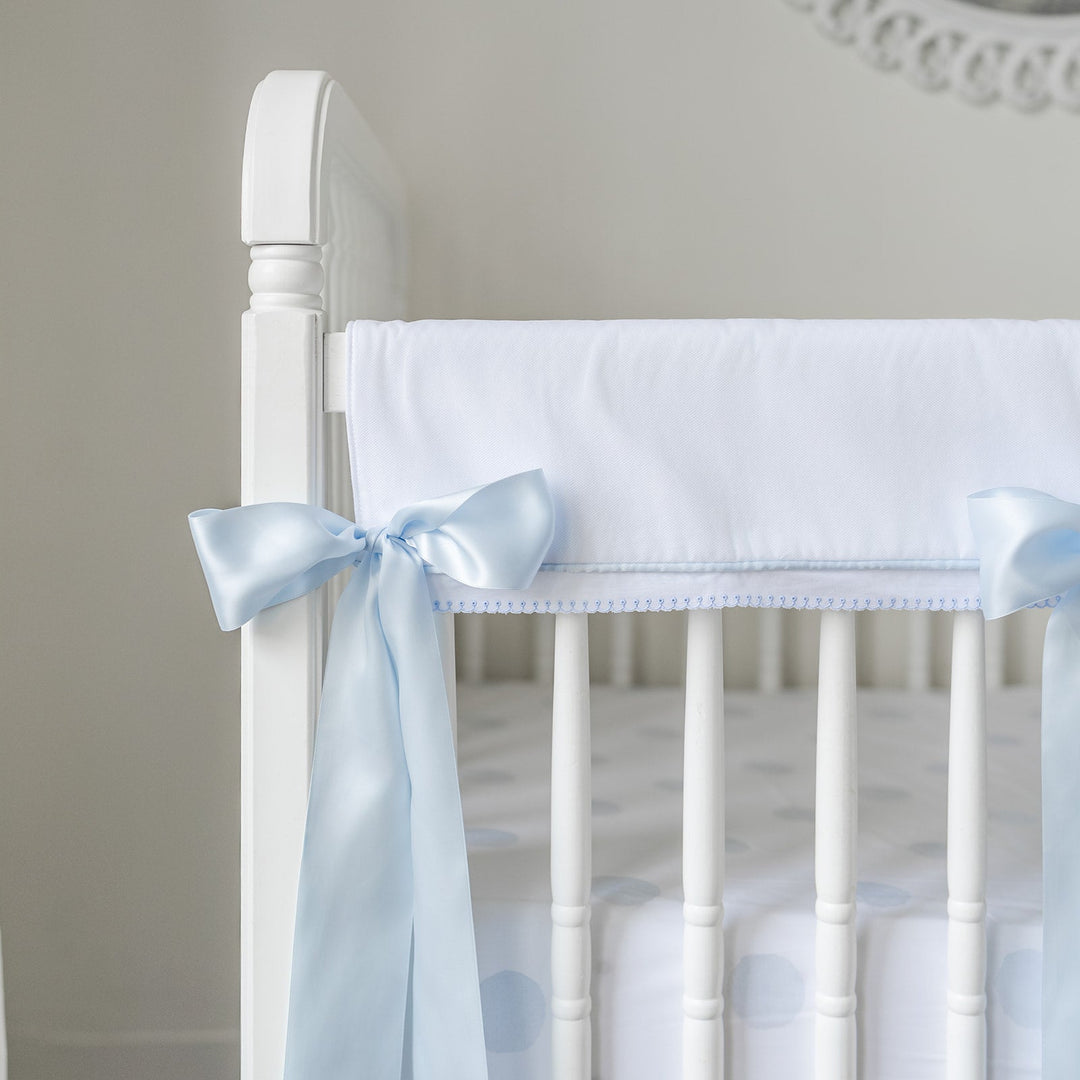 White Pique Crib Rail Topper with Blue Ribbon