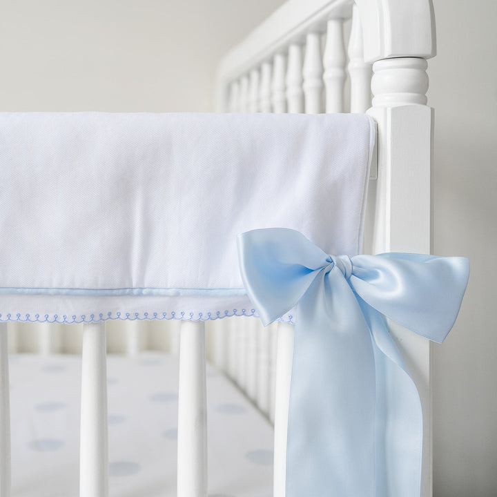 White Pique Crib Rail Topper with Blue Ribbon