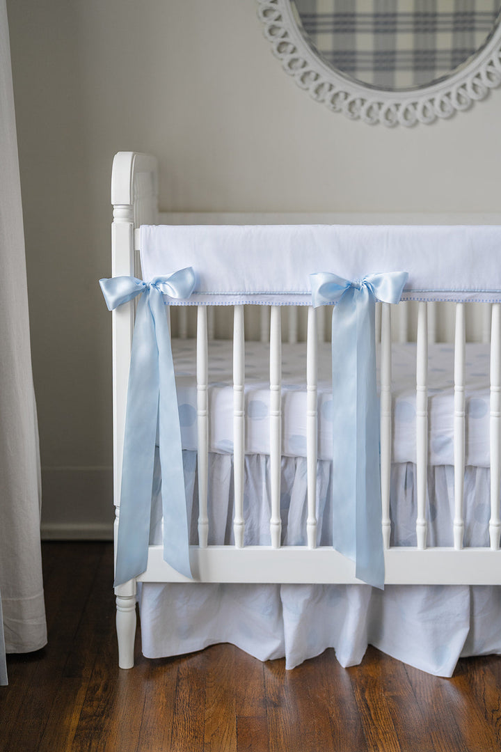 White Pique Crib Rail Topper with Blue Ribbon
